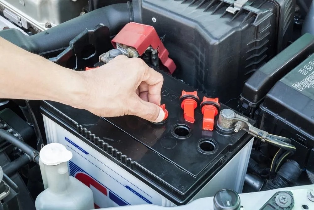 Boonah Batteries technician checking car battery terminals in Boonah